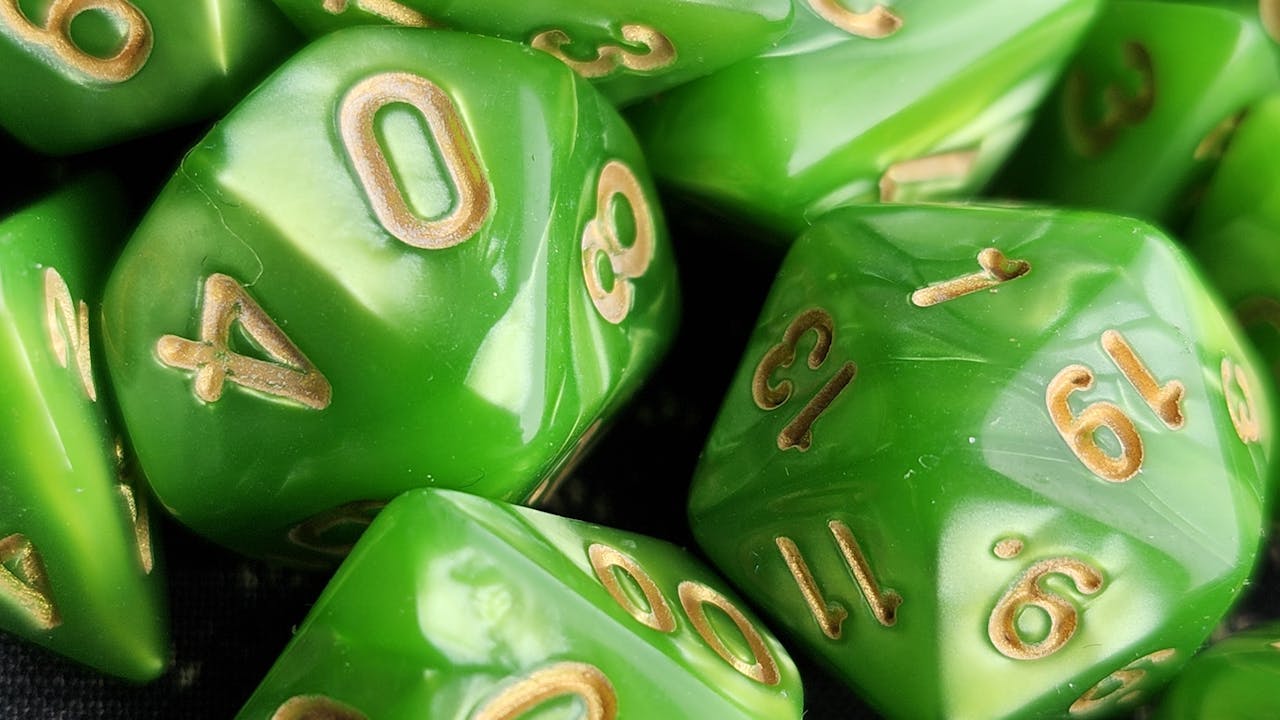 Polyhedral dice set including d20 and supporting dice on dark surface