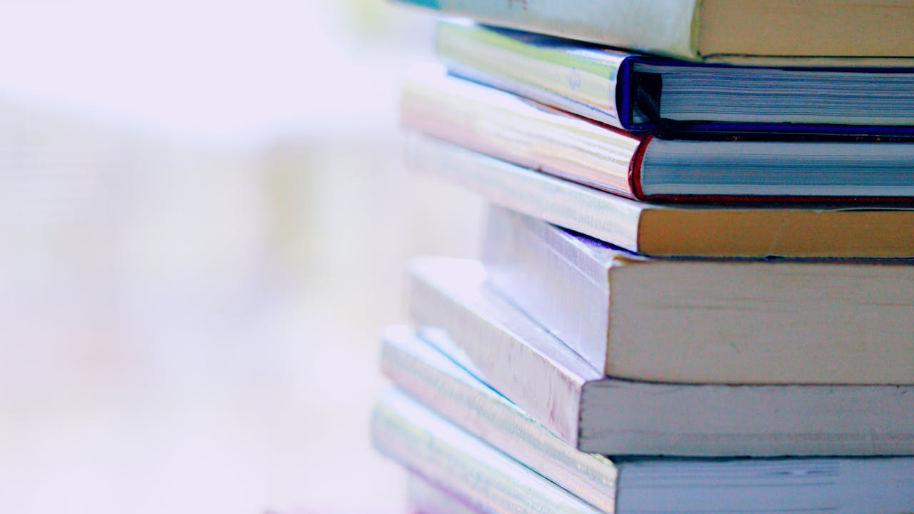 Stack of books on a table, art references and creative inspiration