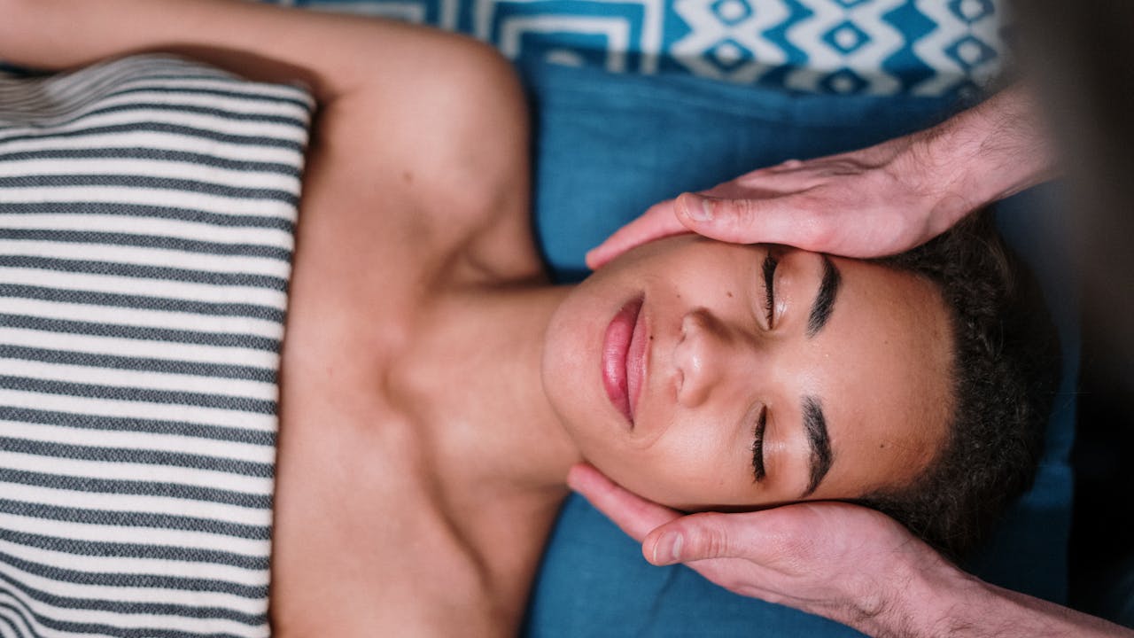 Person receiving a relaxing massage at a day spa