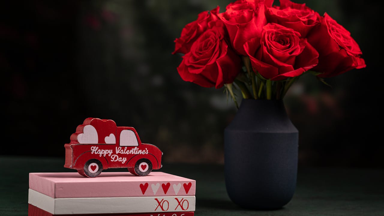 Romantic valentine gift setup with roses and wrapped present